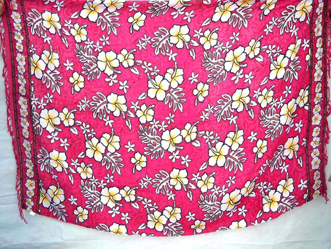 Yellow Hawaiian hisbiscus flowers on red batik wrapping dress