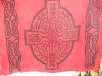 Red rayon resort wrap dress with Celtic cross and knot band design 