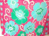 Aqua colored hibiscus design on pink holiday wrap skirt