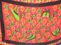Green butterfly pattern on red party sarong