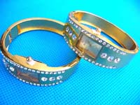 Gold colored fashion bangle watch with imitation diamonds inlaid