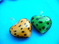 Leopard spot theme inside modern heart shaped hand blown glass pendant