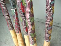Musical wood didgeridoo with artist paintings