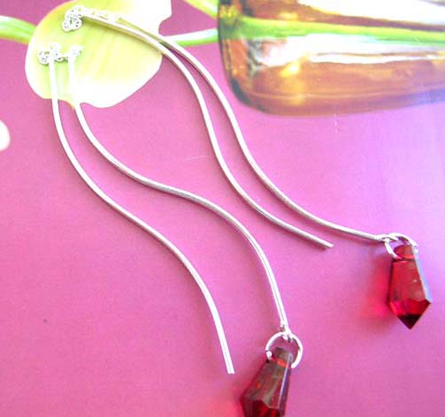 Fashion warehouse boutique - Stylish Sterling silver thread earring with curvy pole holding cz in crystal shape