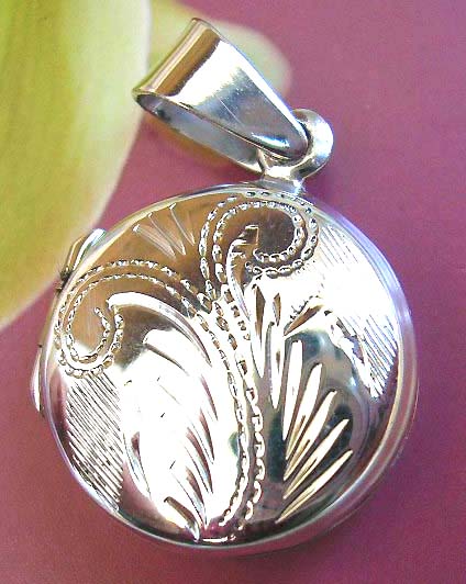  Floral art design on circle locket, made from sterling silver - distributing jewelers exchange     