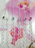 Cz gem connects beaded chain and twisted pole earrings, made from sterling silver