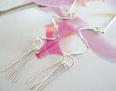 Curved sterling silver pole earrings with multi rods dangling below