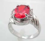 Wholesale exotic jewelry, an orange cz oval shape with 3 mini clear cz and twist pattern on each side, cz ring