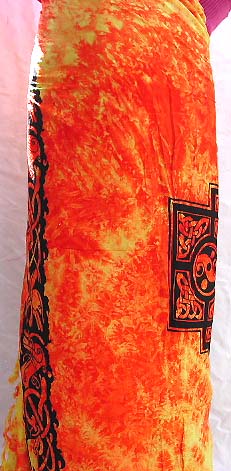 Orange Batik rayon sarong with Celtic cross pattern at center and Celtic knot work pattern on each corner 