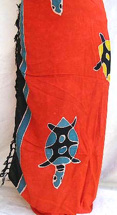 Batik saronf from Indonesia - orange rayon sarong with multi turtle decor