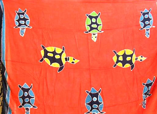 Batik saronf from Indonesia - orange rayon sarong with multi turtle decor