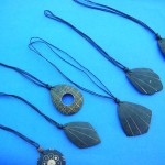wholesale amber necklaces. Summer coconut pendant design on black string necklace