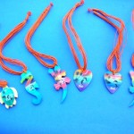 Fashion Jewelry Necklaces. Hawaiian sunset colored wooden pendant charms on multi string necklace
