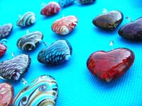 Abstract design inside heart shaped hand blown glass pendant