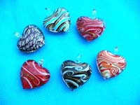 Abstract design inside heart shaped hand blown glass pendant
