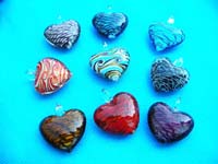Abstract design inside heart shaped hand blown glass pendant